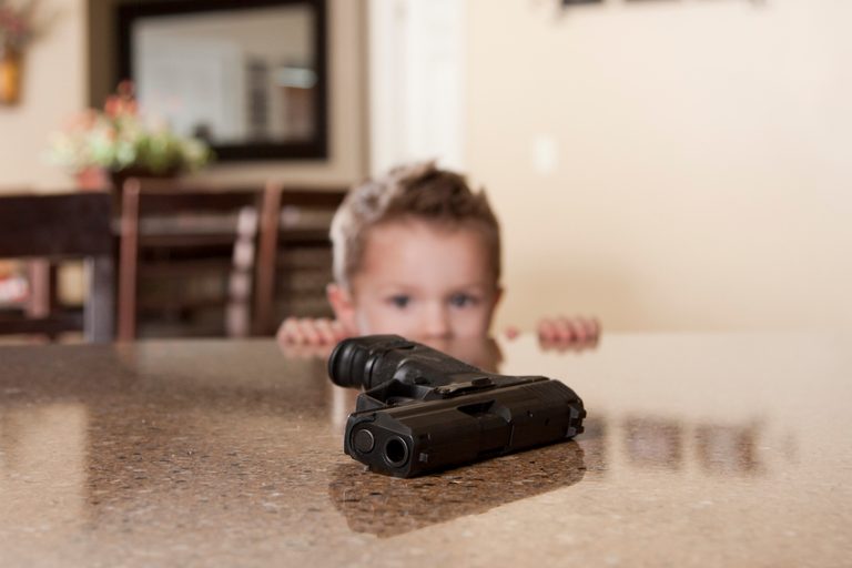 Seeing a child so close to an unsecured handgun highlights why safe firearm storage is critical for preventing tragic accidents.