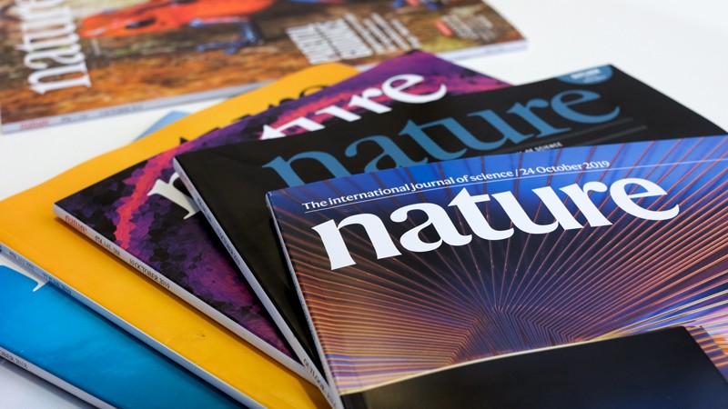 Seeing a stack of Nature magazines with vibrant covers reminds me of my passion for science and staying informed.